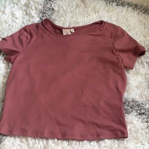 a pink cropped t-shirt